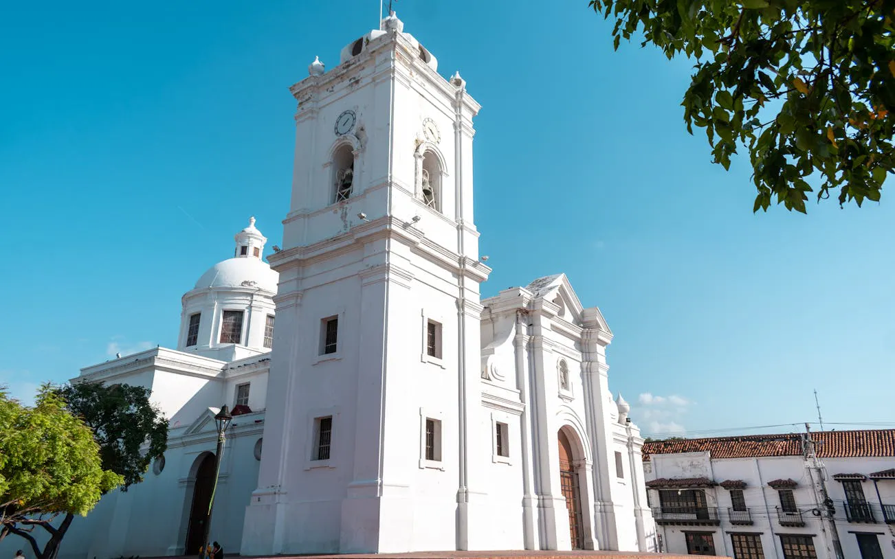 Colonial cathedral in Santa Marta, Colombia, under a clear blue sky.