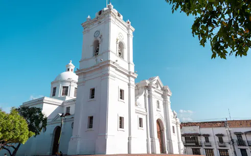 Colonial cathedral in Santa Marta, Colombia, under a clear blue sky.