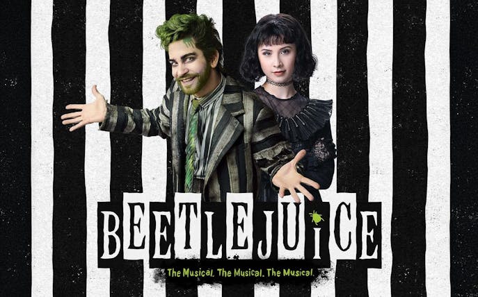 Characters from Beetlejuice Musical in striped costumes with logo.