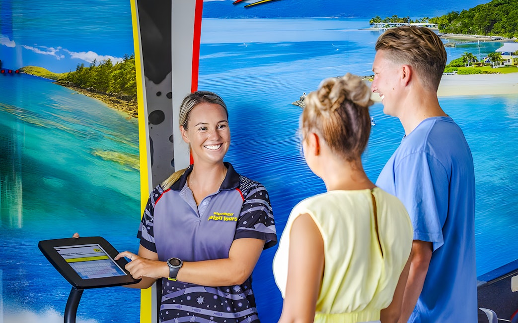 Tourists receiving jetski tour information from a guide in Whitsundays.