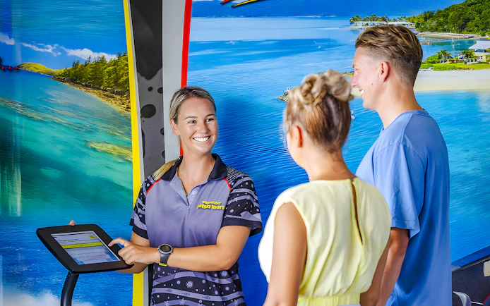 Tourists receiving jetski tour information from a guide in Whitsundays.