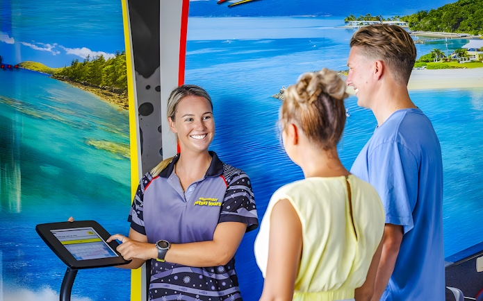 Tourists receiving jetski tour information from a guide in Whitsundays.
