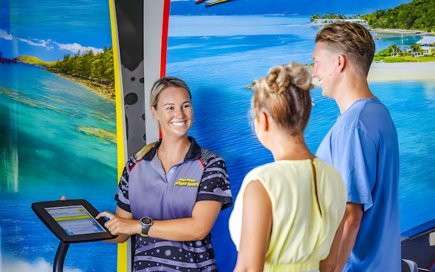 Tourists receiving jetski tour information from a guide in Whitsundays.