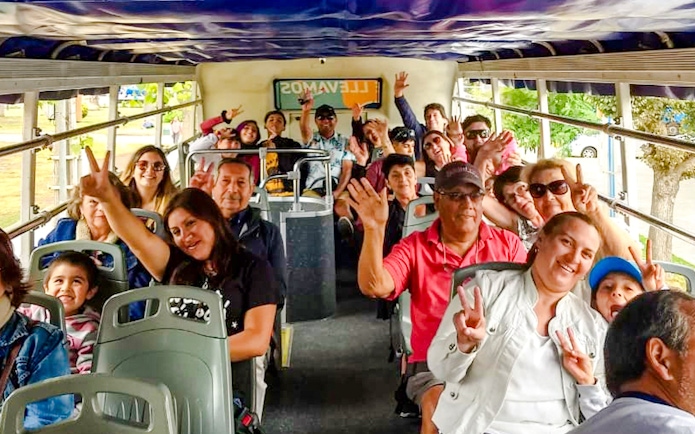 Tourists enjoying a ride on the Santiago hop-on hop-off bus.