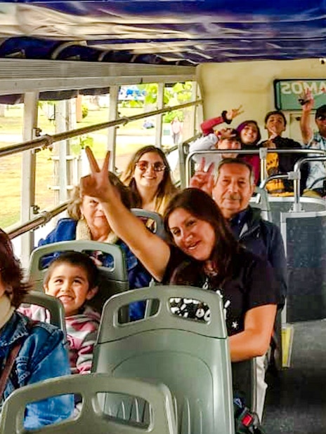 Tourists enjoying a ride on the Santiago hop-on hop-off bus.
