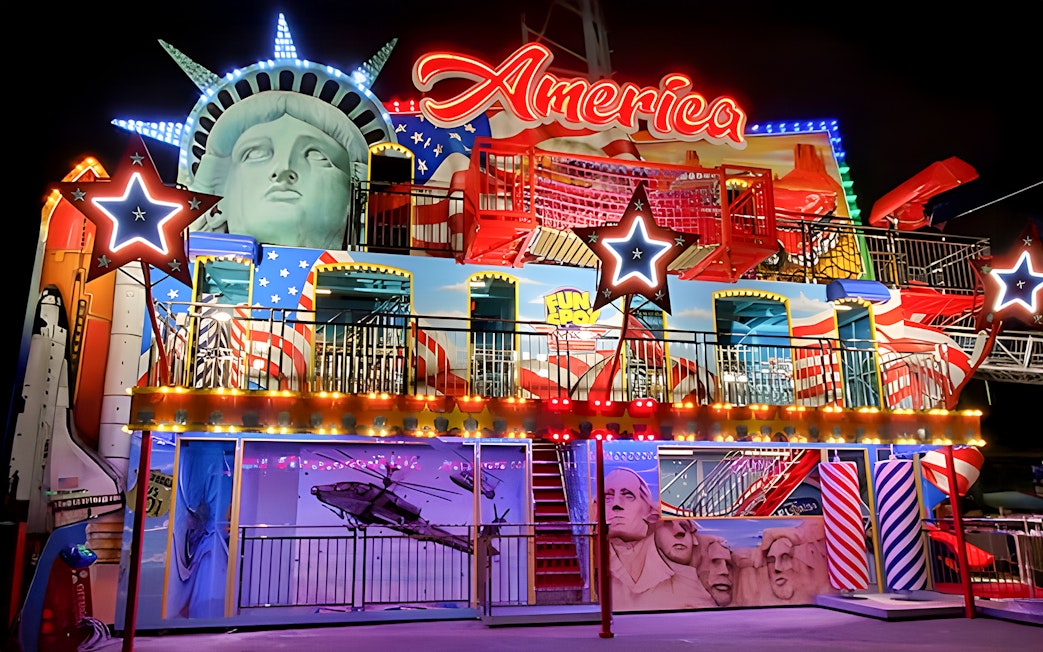 Fun Spot America Theme Park facade with Statue of Liberty and Mount Rushmore elements.