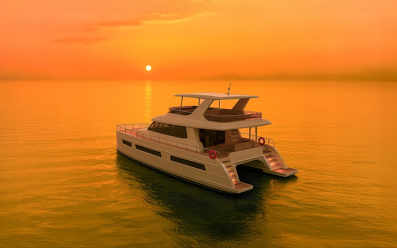 Langkawi sunset cruise with guests on deck, enjoying ocean views and vibrant sky.