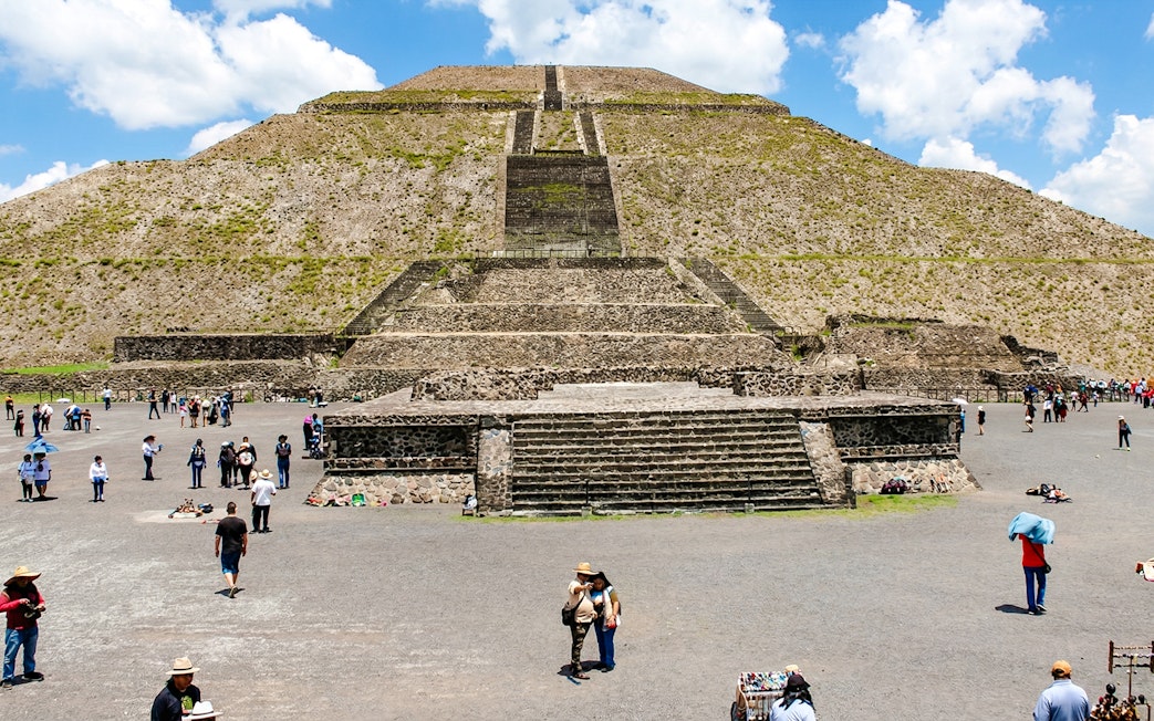 Teotihuacán Pyramid of the Sun with tourists exploring the site, Mexico.