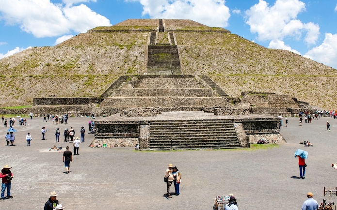 Teotihuacán Pyramid of the Sun with tourists exploring the site, Mexico.