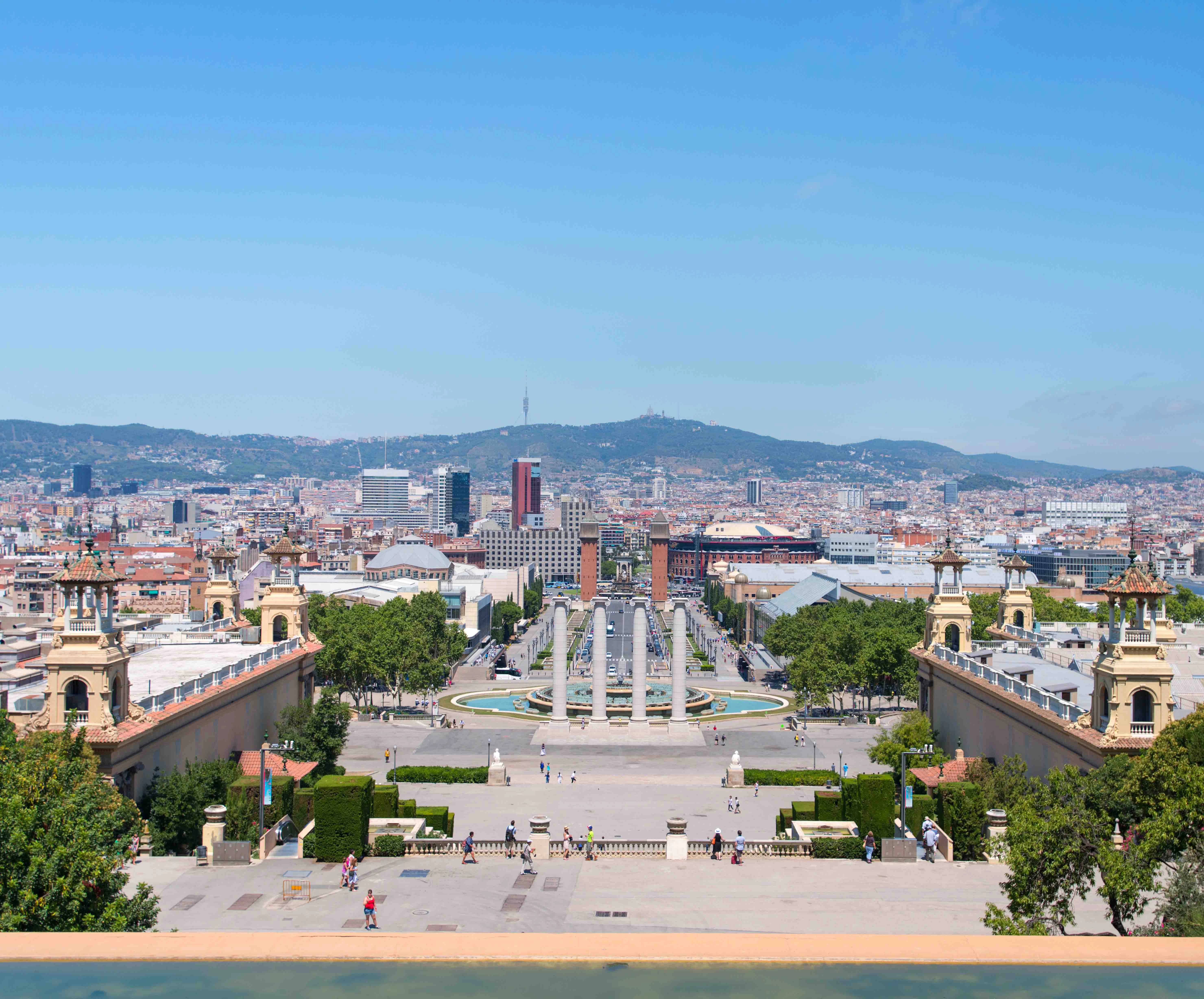 View from Museu Nacional d’Art de Catalunya overlooking Barcelona cityscape and fountains.