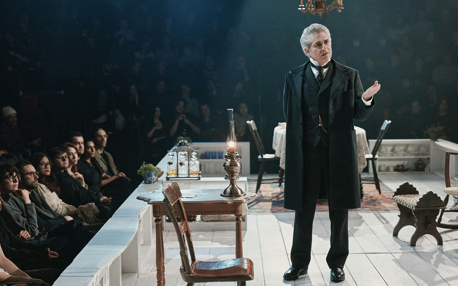 Stage performance of "An Enemy of the People" with actor addressing audience.