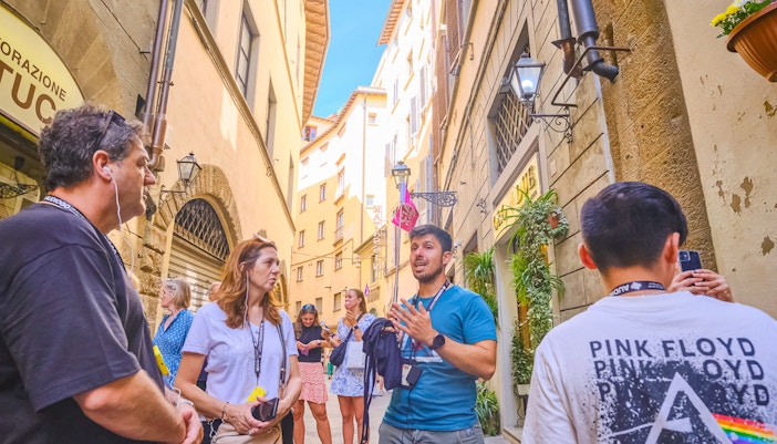 Florence guided tour group exploring the historic Ponte Vecchio bridge.