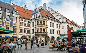 Hofbräuhaus beer hall exterior with people in Munich, part of self-guided city exploration game.