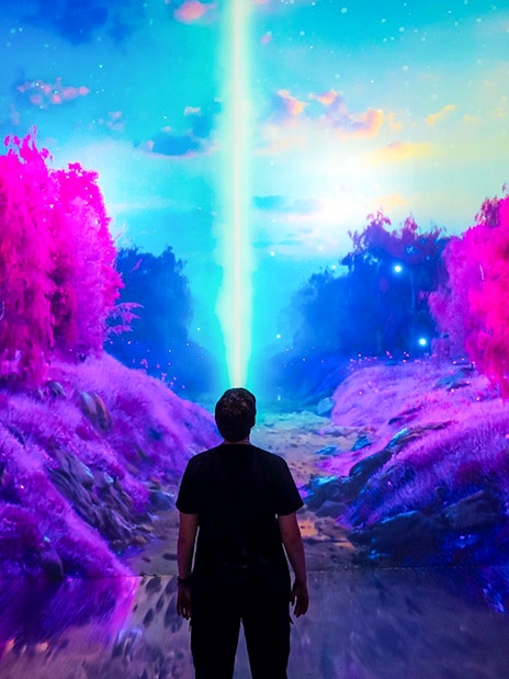 Guests viewing digital art installation at ARTECHOUSE New York.