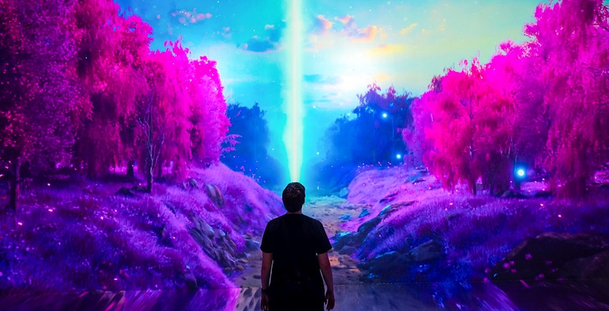 Guests viewing digital art installation at ARTECHOUSE New York.