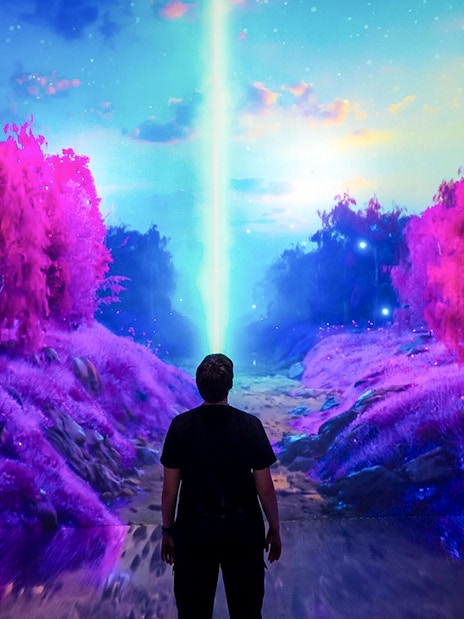 Guests viewing digital art installation at ARTECHOUSE New York.