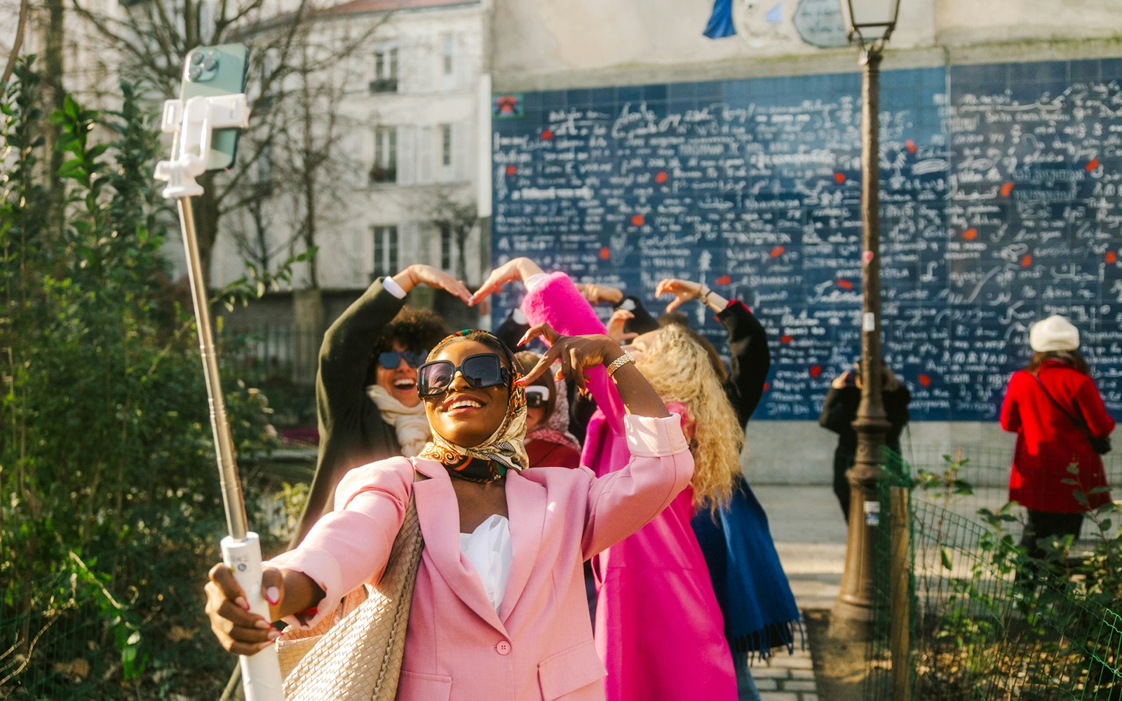Selfie at Montmartre's "I Love You Wall" during Emily in Paris tour.