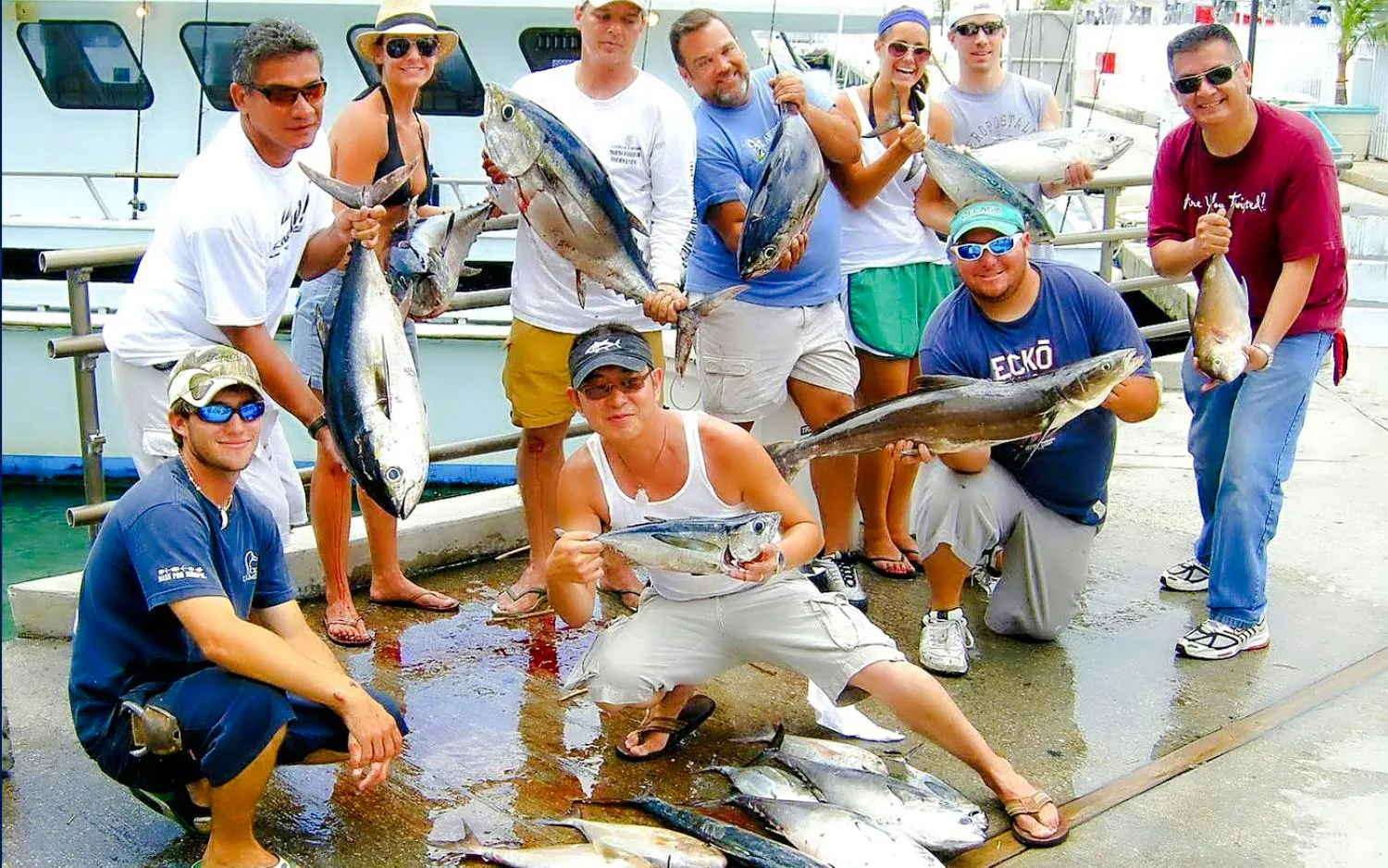 Guests displaying their catch during Miami Sport Fishing tour.