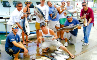 Guests displaying their catch during Miami Sport Fishing tour.