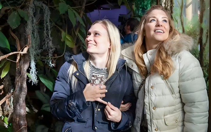 Visitors exploring an exhibit at London Zoo.