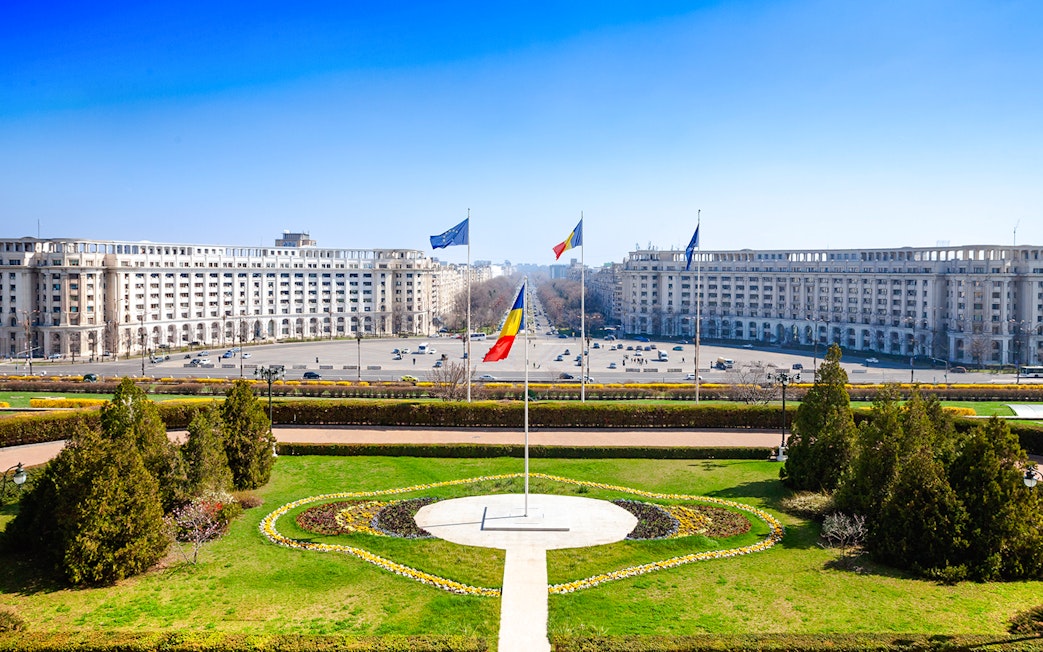 Constitution Square view from Palace of Parliament, Bucharest, with Romanian flag.