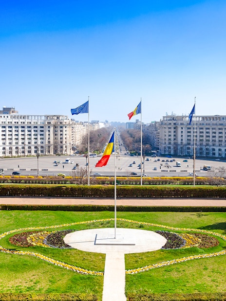 Constitution Square view from Palace of Parliament, Bucharest, with Romanian flag.