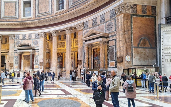 Visitors exploring the interior of the Pantheon in Rome, Italy.