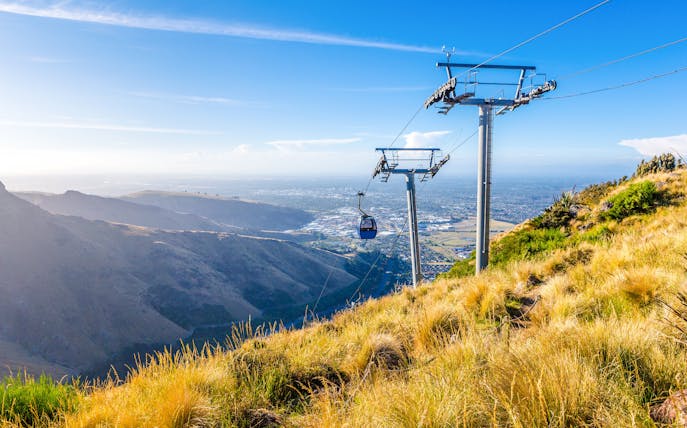 Gondola ride over hills with city view, Christchurch.