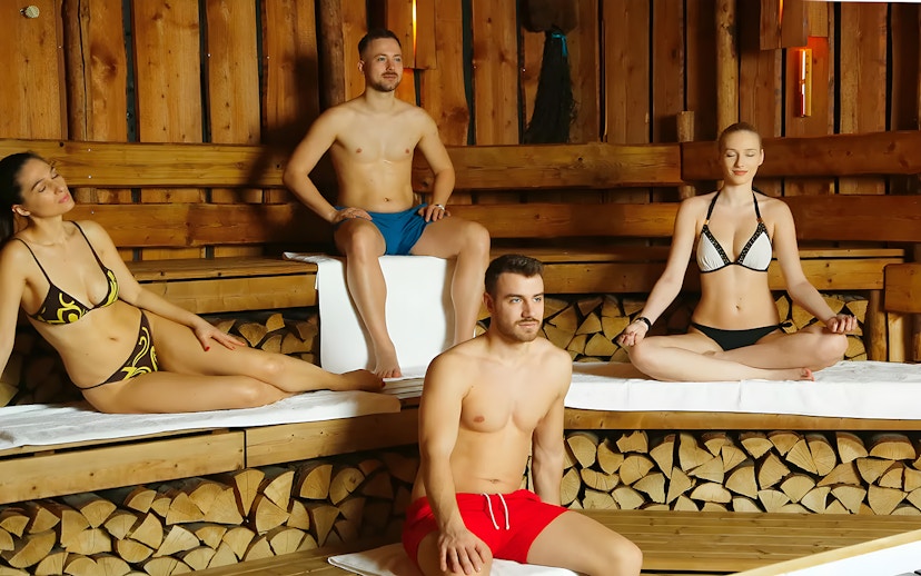 Tourists relaxing in a sauna at Therme Bucuresti Spa, part of a Bucharest combo tour.