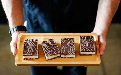 Chocolate desserts on a wooden tray during Seattle Center food tour.