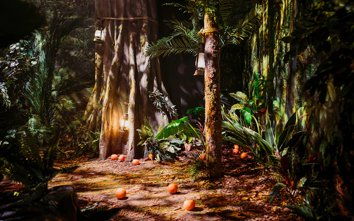 Peru-themed jungle setup with lanterns and oranges at Paddington Bear Experience, London.