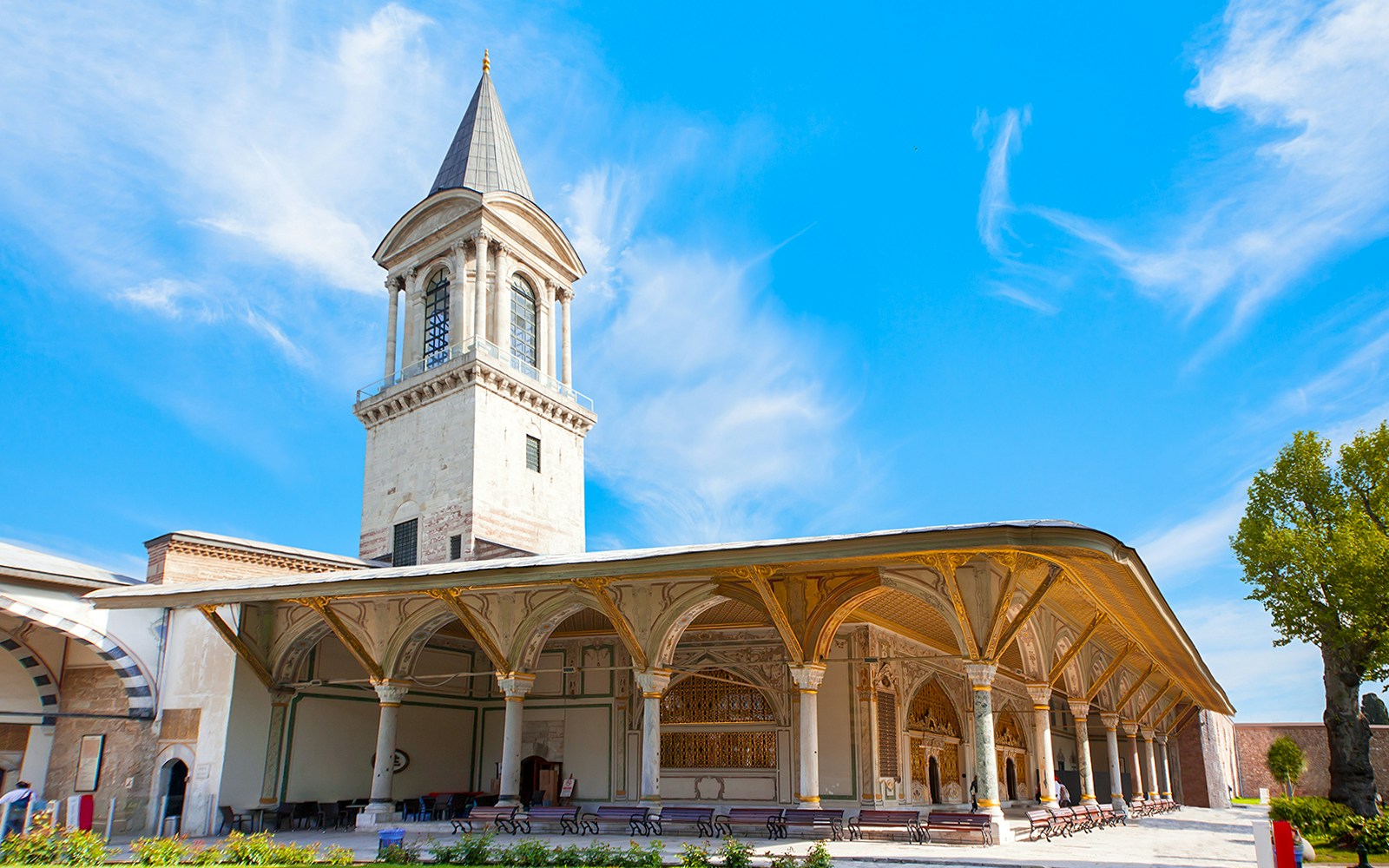 Topkapi Palace courtyard with tourists exploring in Istanbul.