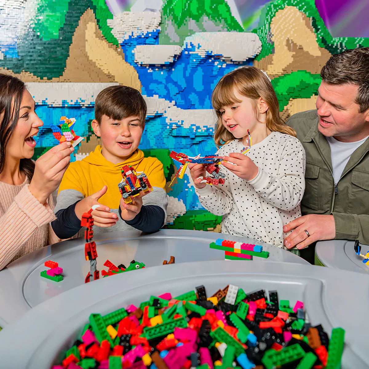 Guests building with Lego bricks at Legoland Windsor.