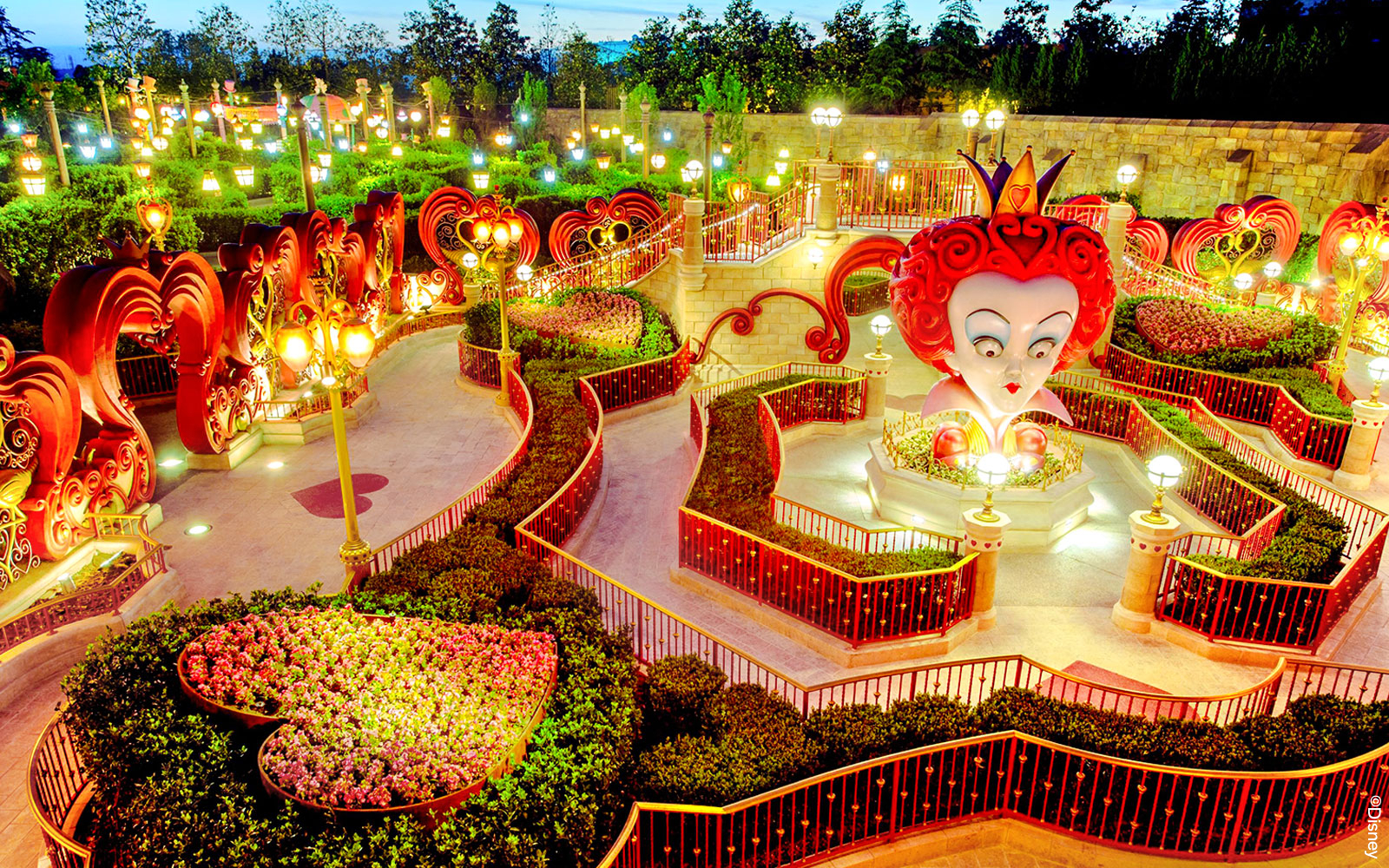 Queen of Hearts maze at Shanghai Disney with illuminated pathways and topiary designs.