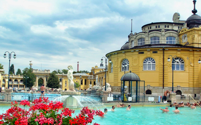 Tourists enjoying the premium day spa at Szechenyi Bath in Budapest, Hungary with full-day access tickets and private cabin