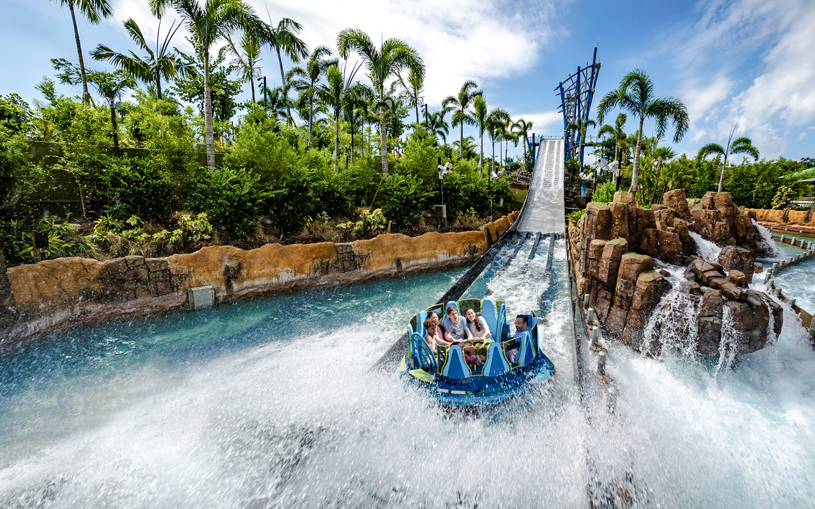 Raft descending the Infinity Falls river rapids ride at SeaWorld Orlando.