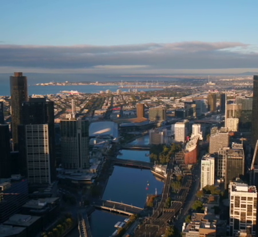 Gondola gliding through Venice canal with historic buildings in the background.