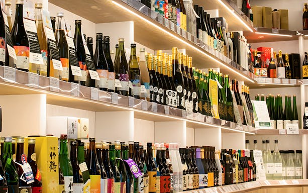 Sake bottles displayed at Seibu Ikebukuro Main Branch for a sake tasting tour.