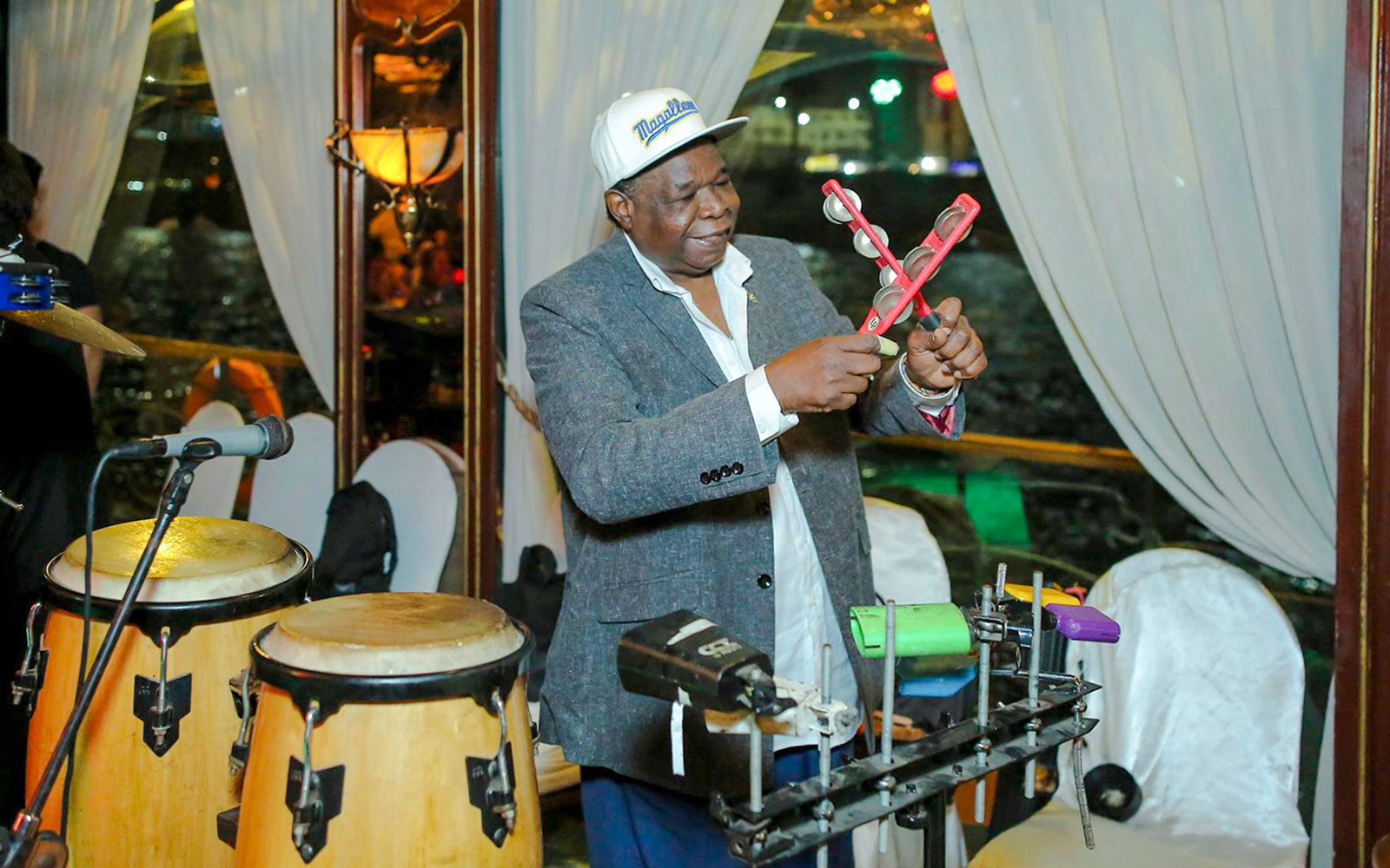 Musician playing percussion on a Nile dinner cruise.