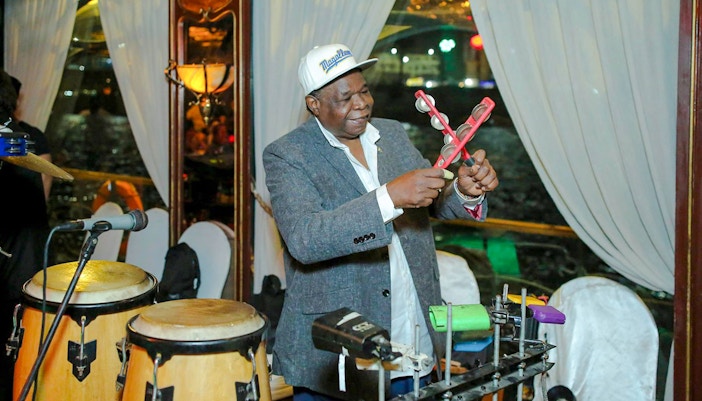 Musician playing percussion on a Nile dinner cruise.