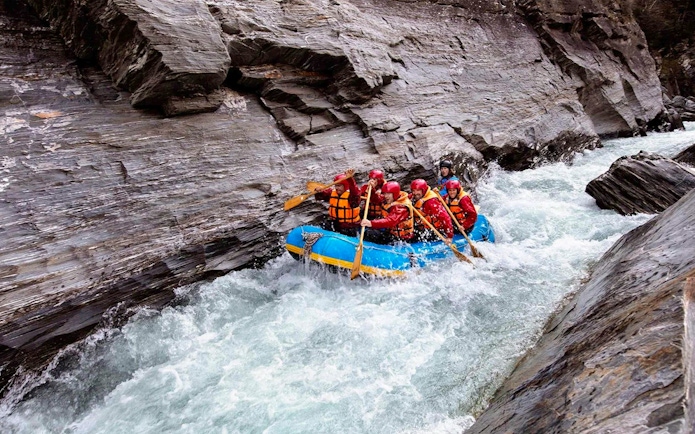 Rafting group navigating rapids on Shotover River, Queenstown.