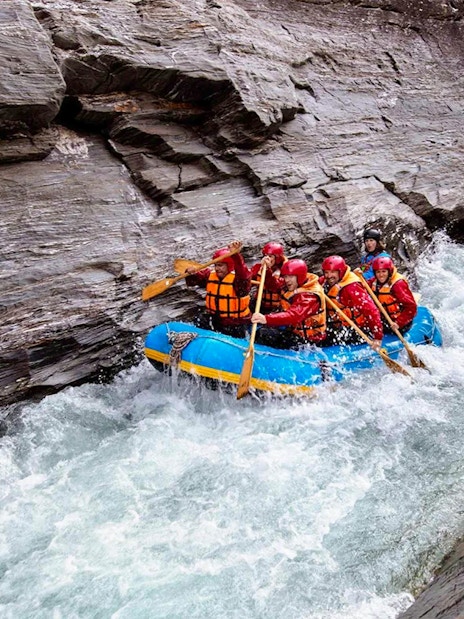 Rafting group navigating rapids on Shotover River, Queenstown.