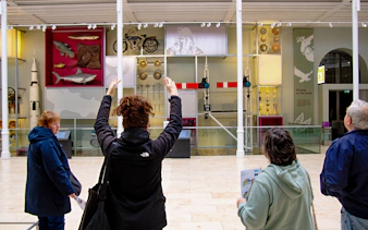 Visitors on a guided tour at the National Museum of Scotland in Edinburgh.