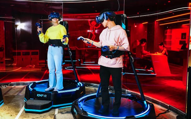 Tourists using VR headsets at RED TOKYO TOWER experience.