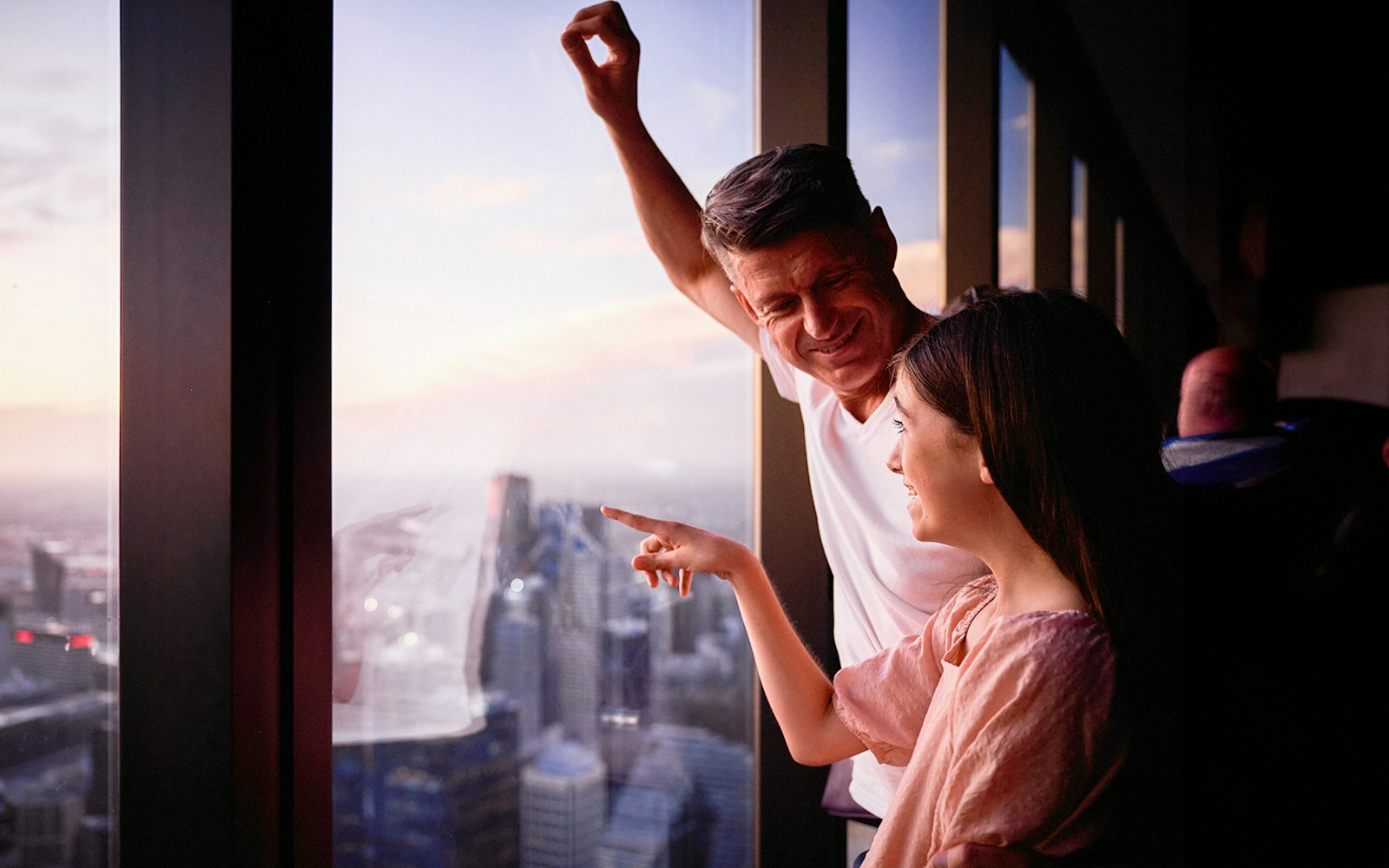 Visitors enjoying the view from Melbourne Skydeck at sunset.