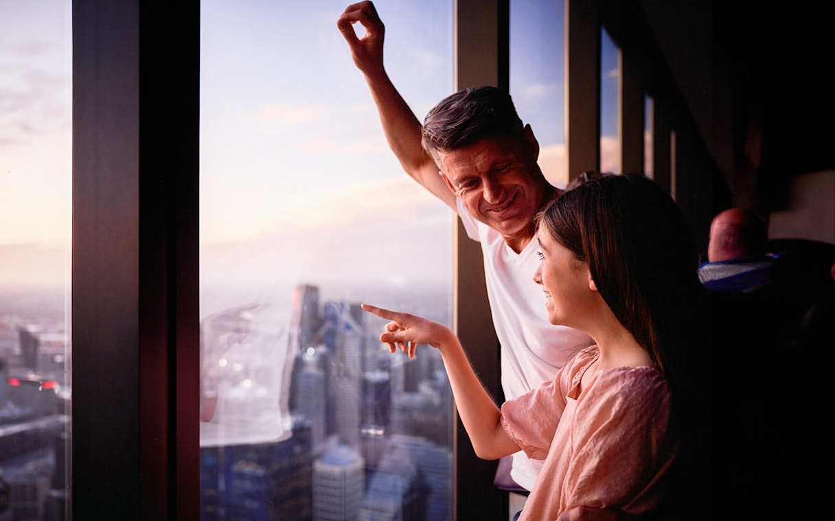Visitors enjoying the view from Melbourne Skydeck at sunset.