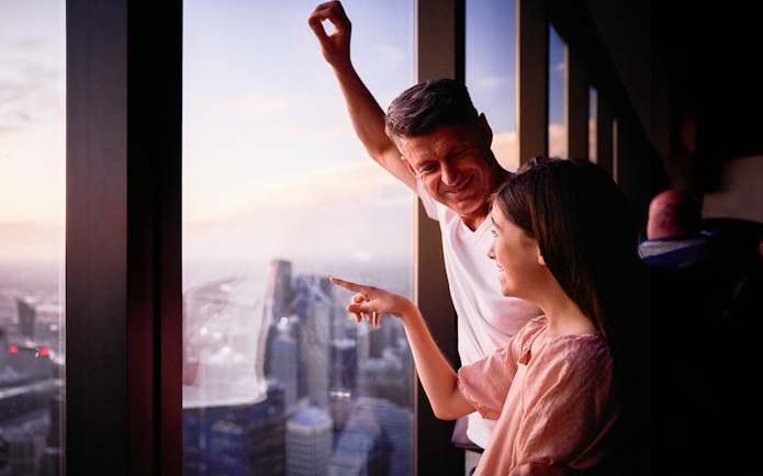 Visitors enjoying the view from Melbourne Skydeck at sunset.