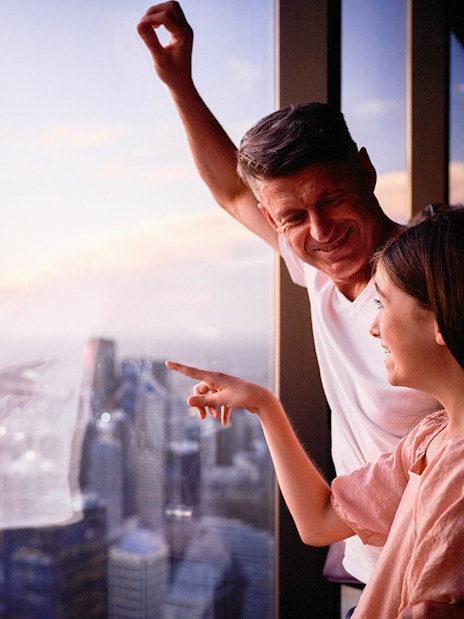 Visitors enjoying the view from Melbourne Skydeck at sunset.