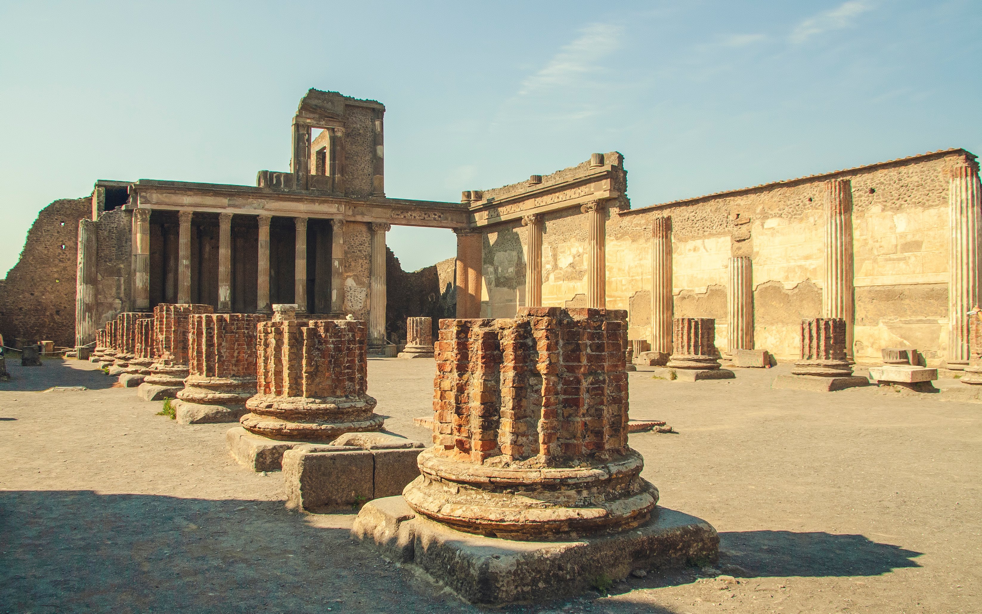 Ruins of the Basilica with ancient columns in Pompeii, Italy.