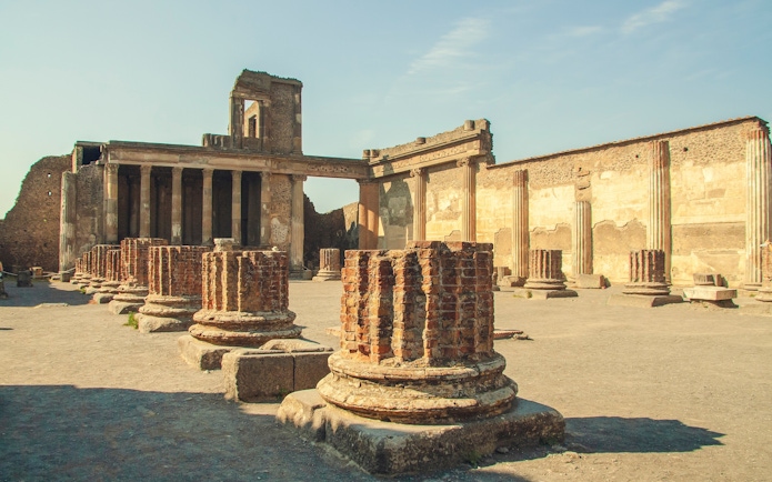 Ruins of the Basilica with ancient columns in Pompeii, Italy.